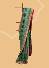 Teal Green Tussar Georgette Saree with Light Pink Motifs