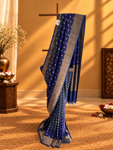Tussar georgette dollar booti saree shaded in indigo and gray colour and a zari border and pallu