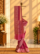 Almond cream and wine ombré shaded tussar georgette saree with a traditional paisley border and pallu