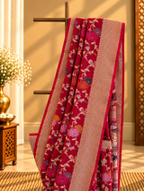 Rani pink muga georgette saree with multi coloured flower bel and a geometric border and pallu