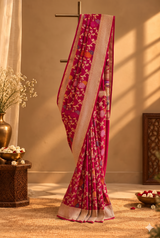 Rani pink muga georgette saree with multi coloured flower bel and a geometric border and pallu