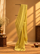 A yellow and zari stipe saree in chanderi georgette with a delicate zari border