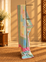 A beautiful muga georgette rangkat in pastel colours of lemon pista sky blue and baby pink handpainted with zari jaal and floral bootis