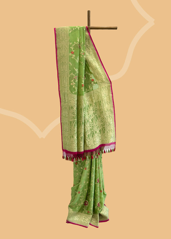  The lime green floral jaal benarasi saree is adorned with pretty pink detailed flowers, with the vibrant wine coloured kanni is perfect for summer wedddings. Shop the best collection of authentic, handwoven, pure benarasi sarees with Roliana New Delhi