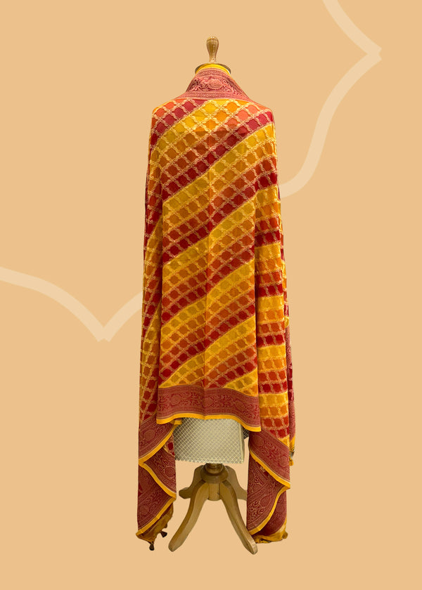  A beautiful barfi jaal Georgette dupatta hand painted shaded of red & orange with a contrast gold kanni. Shop the best of Banarasi sarees, dupattas and lehengas at Roliana New Delhi