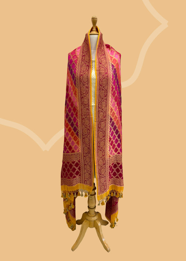  A beautiful barfi jaal Georgette dupatta hand painted shaded of pink and purple with a contrast gold kanni. Shop the best of Banarasi sarees, dupattas and lehengas at Roliana New Delhi