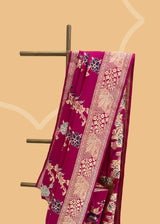 An heirloom-worthy saree, this Rani pink ektara kadhwa is crafted from the finest pure silk Benarasi. Woven by Roliana artisans with a meenakari jaal, its vibrant hue and delicate handwork make it a timelessly elegant piece.