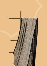 A beautiful silk brocade saree with all over naqshi jaal and an interesting lace border and pallu. Shop the best collection of authentic, handwoven, pure benarasi sarees with Roliana New Delhi