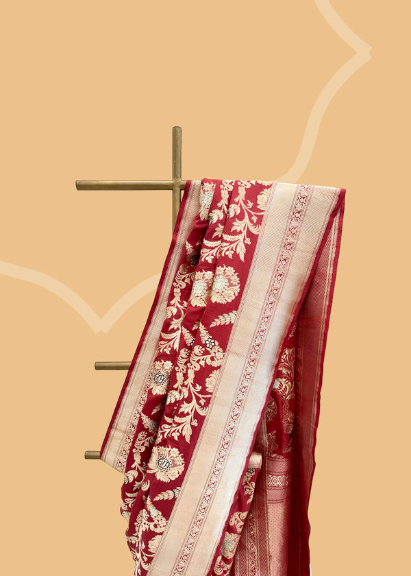 A maroon red gulnaaz floral meenakari benarasi saree perfect for wedddings and trousseau collection. Shop the best collection of authentic, handwoven, pure benarasi sarees with Roliana New Delhi