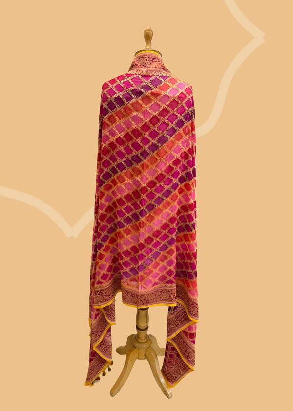  A beautiful barfi jaal Georgette dupatta hand painted shaded of pink and purple with a contrast gold kanni. Shop the best of Banarasi sarees, dupattas and lehengas at Roliana New Delhi