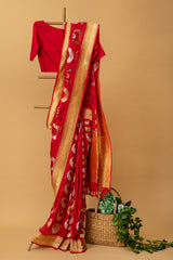 Red pure benarasi georgette handwoven saree with chaand bootis in silver and gold zari all over by Roliana Weaves. Pure Banarasi Saree.