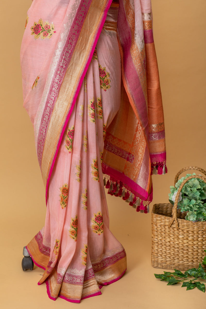 Powder pink floral meenakari pure Linen Saree with silver gold zari bootas by Roliana Weaves. Shop handcrafted summer sarees by Roliana Banaras. Ekaya Tifli