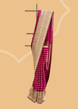 A striking pink satin saree with woven horizontal stripes and a stunning Kanjeevaram inspired border with zari brocade detailing and peacocks Shop the best collection of authentic, handwoven, pure benarasi sarees with Roliana New Delhi