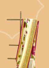 ivory cream saree in Georgette with zari bootis and border and hand painted irises in wine colour all over the saree.. A pure Banarasi wedding Sari Shop the best collection of authentic, handwoven, pure benarasi sarees with Roliana New Delhi