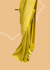 A lime yellow brocade woven saree in a very delicate design with beautiful contrast blue purple detalling.. A pure Banarasi wedding Sari Shop the best collection of authentic, handwoven, pure benarasi sarees with Roliana New Delhi