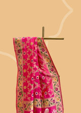 A beautiful Rani pink popat saree with ektaara kangoora jaal and an ornate Bel weave in meenakari border and pallu pure Banarasi sari. Shop the best collection of authentic, handwoven, pure benarasi sarees with Roliana New Delhi