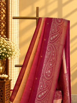 Almond cream and wine ombré shaded tussar georgette saree with a traditional paisley border and pallu