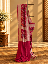 Rani pink muga georgette saree with multi coloured flower bel and a geometric border and pallu