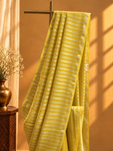 A yellow and zari stipe saree in chanderi georgette with a delicate zari border
