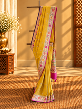 A bright yellow and Rani pink combination tussar georgette saree with a paithani border and pallu