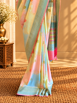 A beautiful muga georgette rangkat in pastel colours of lemon pista sky blue and baby pink handpainted with zari jaal and floral bootis
