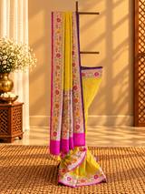 A bright yellow and Rani pink combination tussar georgette saree with a paithani border and pallu