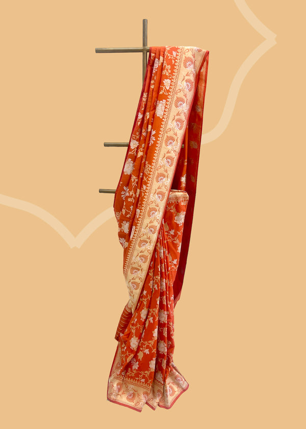 Burnt Orange Katan Silk Benarasi Saree, a stunning and unique garment made with pure handwoven silk. Shop the best collection of authentic, handwoven, pure benarasi sarees with Roliana New Delhi