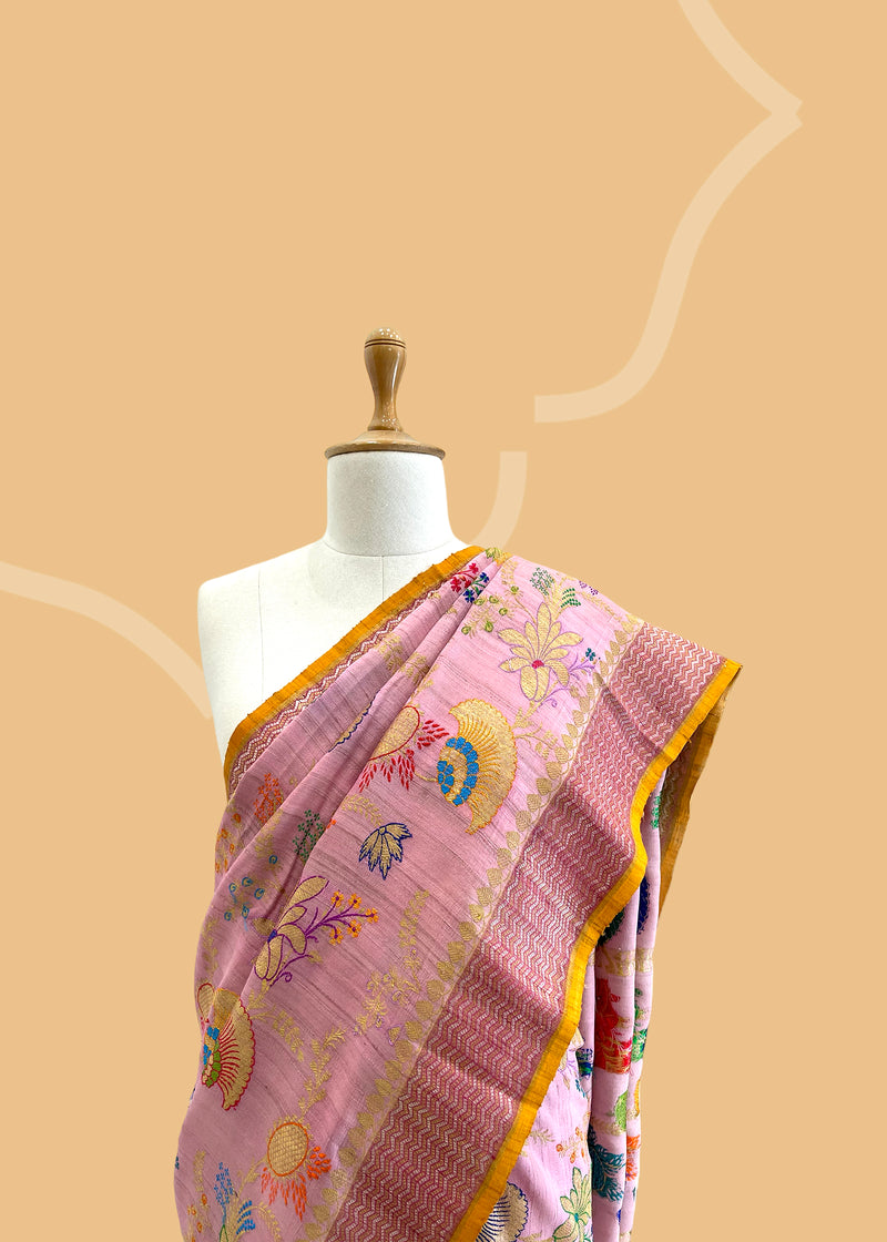 A light pink meenakari kinkhab saree with wine colour border and a contrast yellow kanni and blouse. Shop the best collection of authentic, handwoven, pure benarasi sarees with Roliana New Delhi