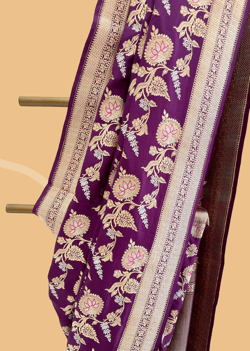 Crafted from beautiful soft silk brocade, this deep magenta pink saree features an intricate antique jaal design and delicate purple meenakari detailing on the body and pallu.  Shop the best collection of authentic, handwoven, pure benarasi sarees with Roliana New Delhi