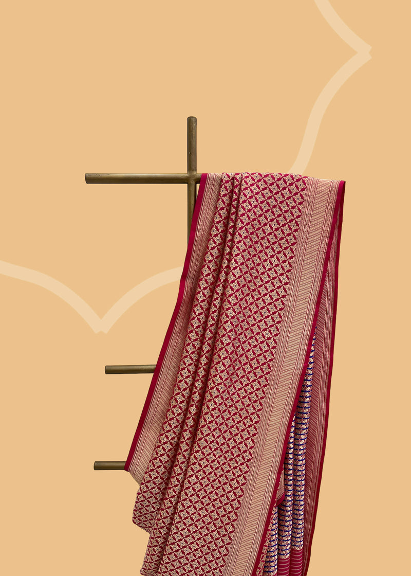 Crafted from beautiful soft silk brocade, this deep magenta pink saree features an intricate antique jaal design and delicate purple meenakari detailing on the body and pallu.  Shop the best collection of authentic, handwoven, pure benarasi sarees with Roliana New Delhi