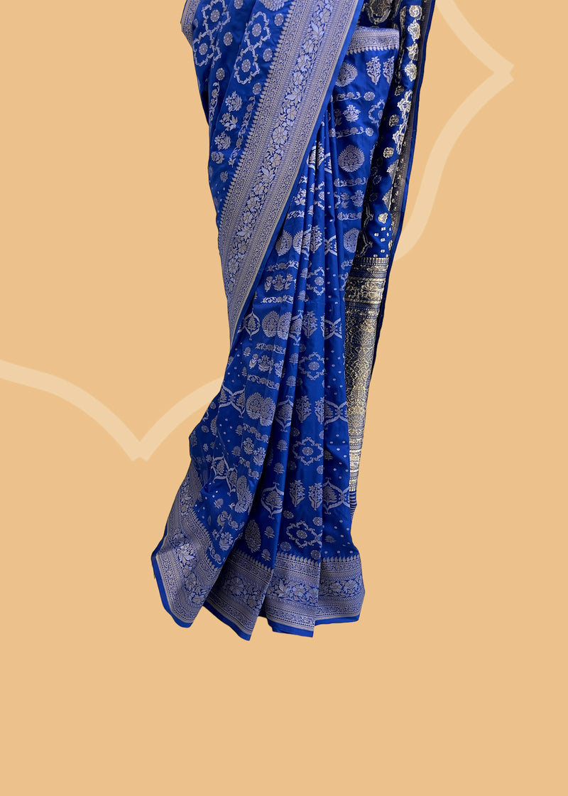 A royal blue ektaara weave with silver and gold zari saree. Shop the best collection of authentic, handwoven, pure benarasi sarees with Roliana New Delhi