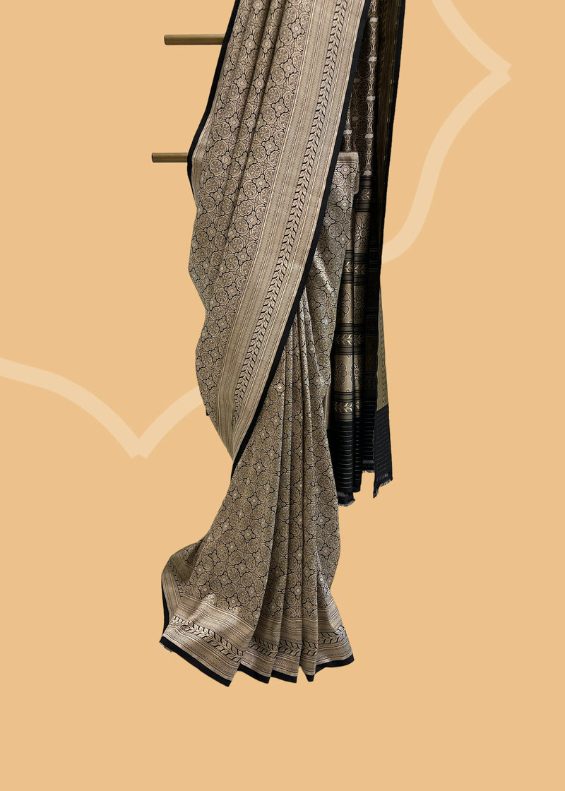 A beautiful silk brocade saree with all over naqshi jaal and an interesting lace border and pallu. Shop the best collection of authentic, handwoven, pure benarasi sarees with Roliana New Delhi
