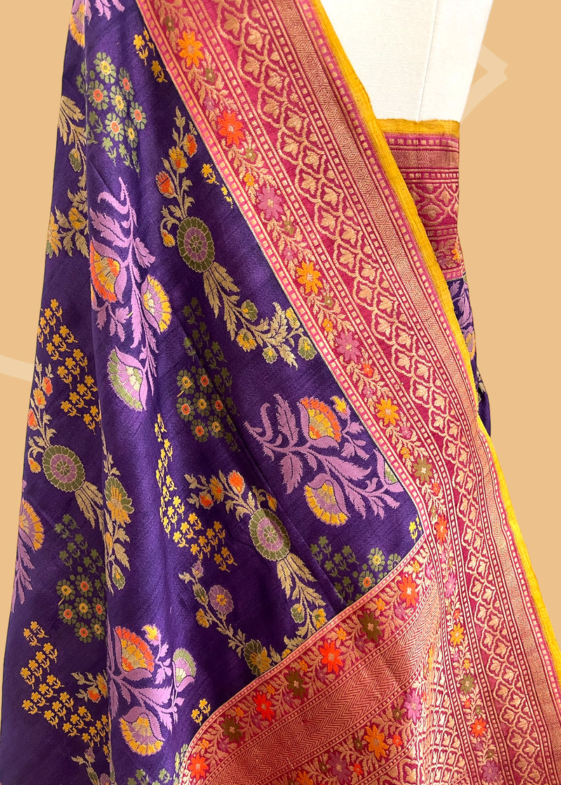 This multi-weave saree features an eggplant purple hue with a stunning kinkhab design.  Shop the best collection of authentic, handwoven, pure benarasi sarees with Roliana New Delhi