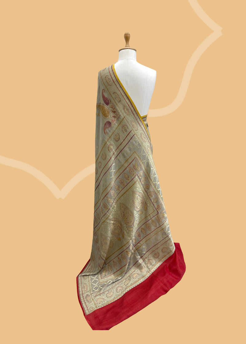 A cement gray munga Georgette saree with a delicate weave and contrast ganga jamuna borders and kanni with hand painted bootis Shop the best collection of authentic, handwoven, pure benarasi sarees with Roliana New Delhi
