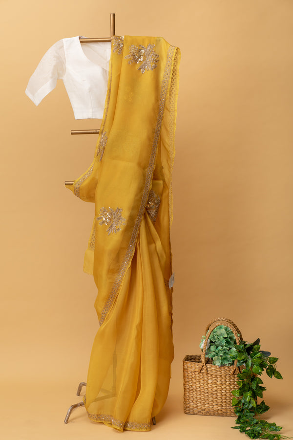 Yellow pure organza handwoven saree with floral zardozi embroidery by Roliana Weaves. Shop handcrafted sarees online. Ekaya, Tifli, Sacred Weaves