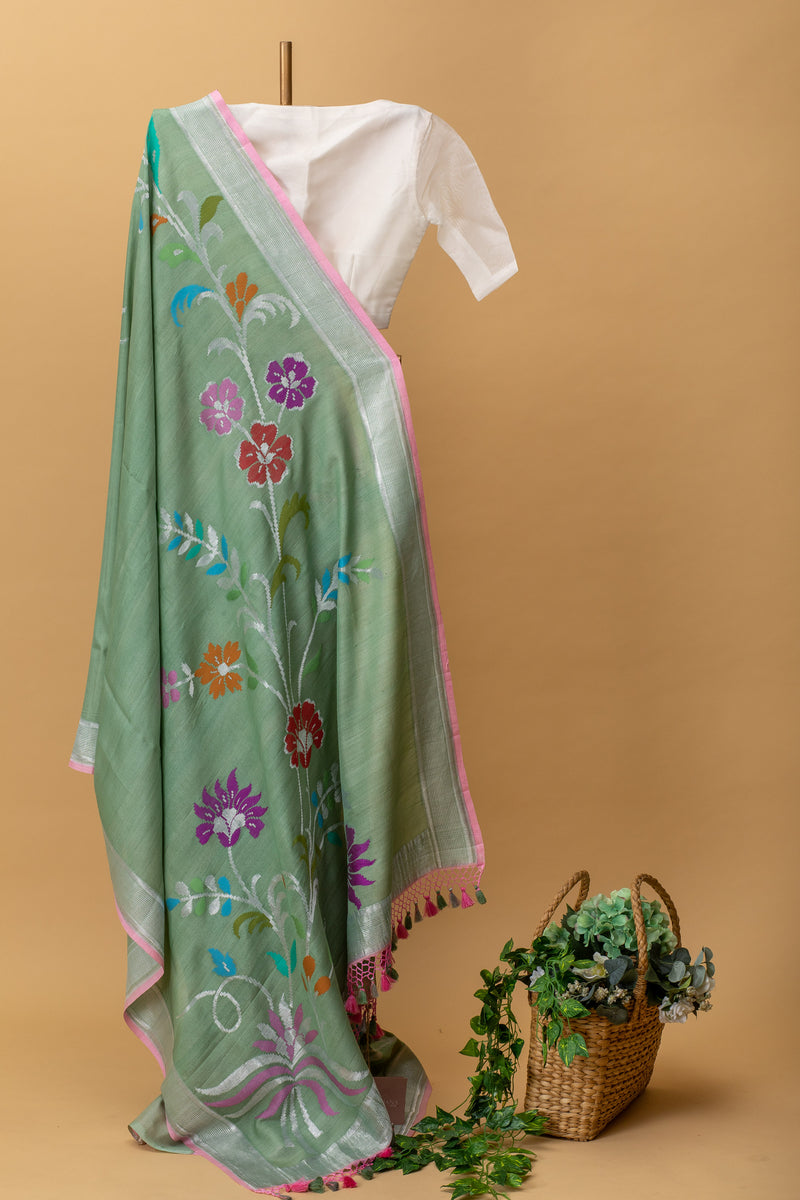 Green tussar georgette handwoven pure banarasi saree with a spray of meenakari by Roliana Weaves. Shop exclusive handwoven sarees this summer at Roliana Benaras online store.