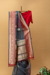 Gray handwoven pure benarasi kora silk saree with zari bootis and a contrast red zari border by Roliana Weaves. Shop exclusive sarees at Roliana online store.