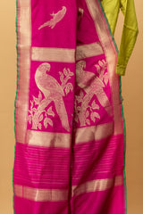 A Rani pink pure handwoven benarasi silk saree with zari parrot bootas all over by Roliana Weaves. Best Banarasi sari online.