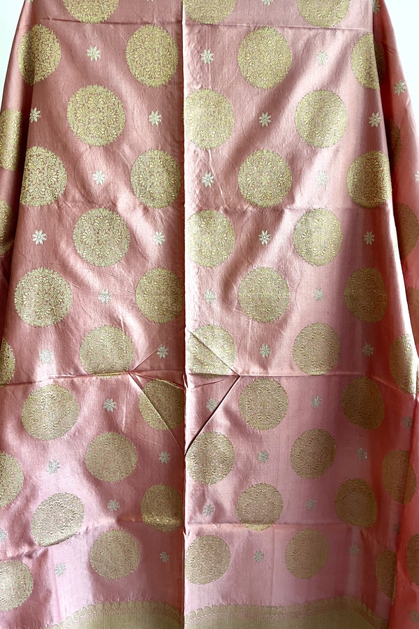 coral coloured silk dupatta with circular floral motifs woven all over, and a traditional benarasi border, by Roliana