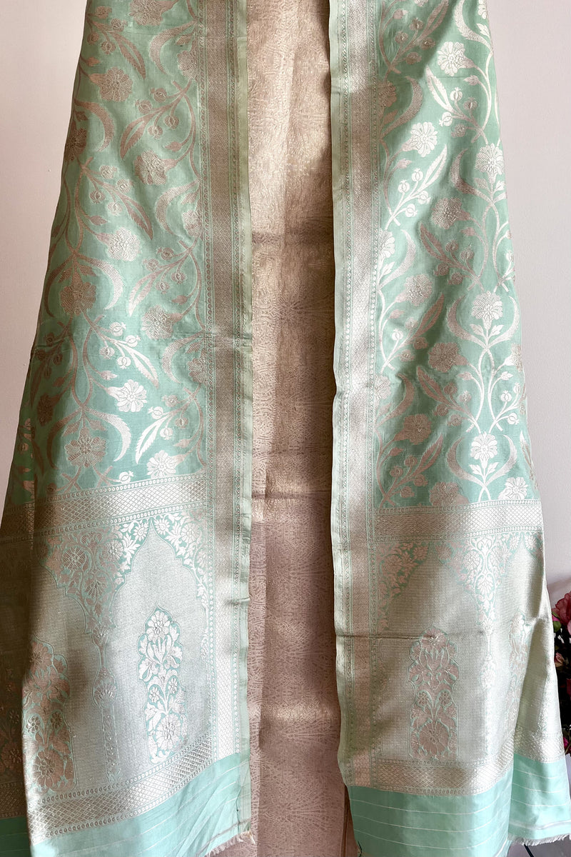 A pista green pure silk banarasi dupatta with woven floral jaal in silver zari by roliana weaves.