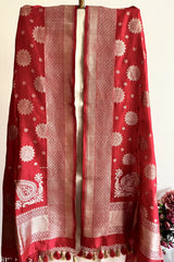 A red silk dupatta wuth floral motifs scattered all over the pure banarasi silk dupatta by Roliana Weaves