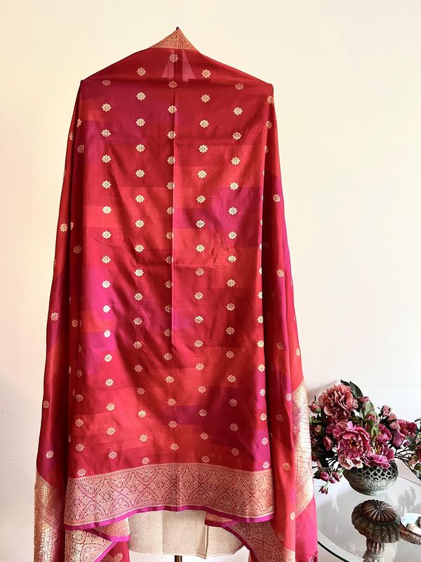 Red silk banarasi dupatta with dollar floral motifs all over and a traditional barfi border by Roliana Weaves.