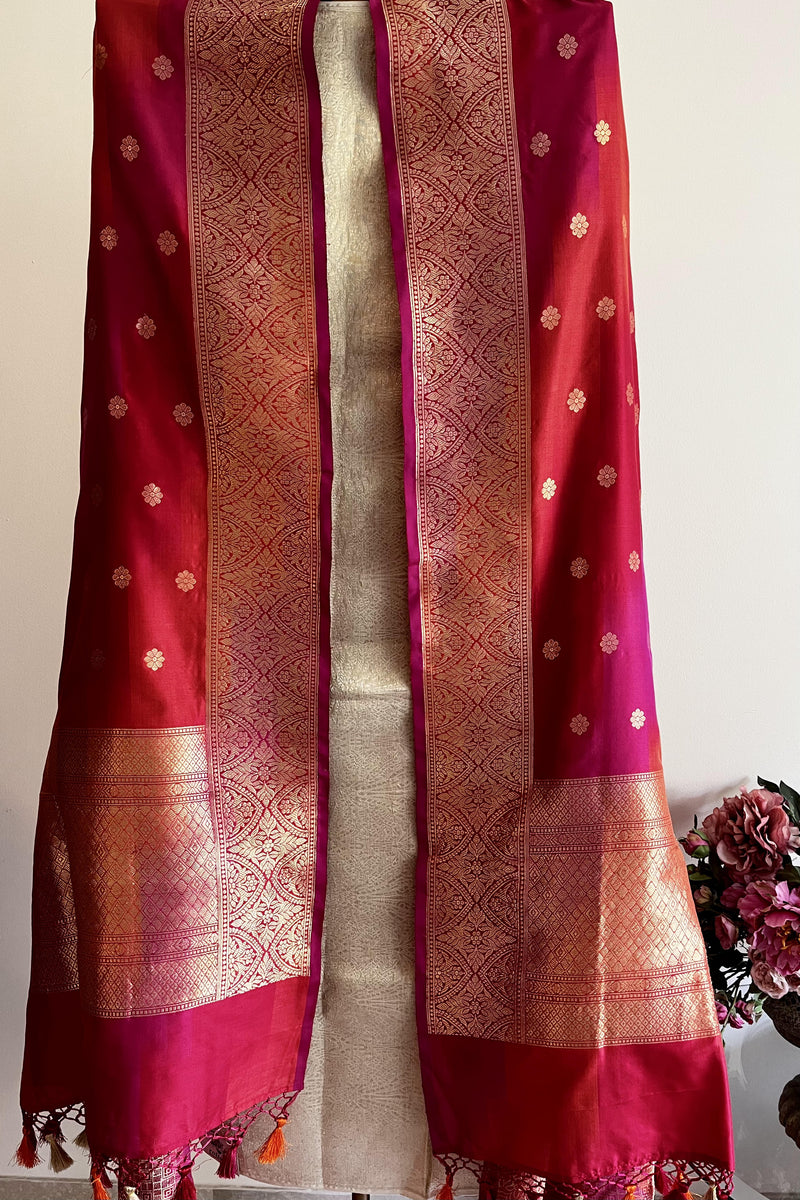 Red silk banarasi dupatta with dollar floral motifs all over and a traditional barfi border by Roliana Weaves.