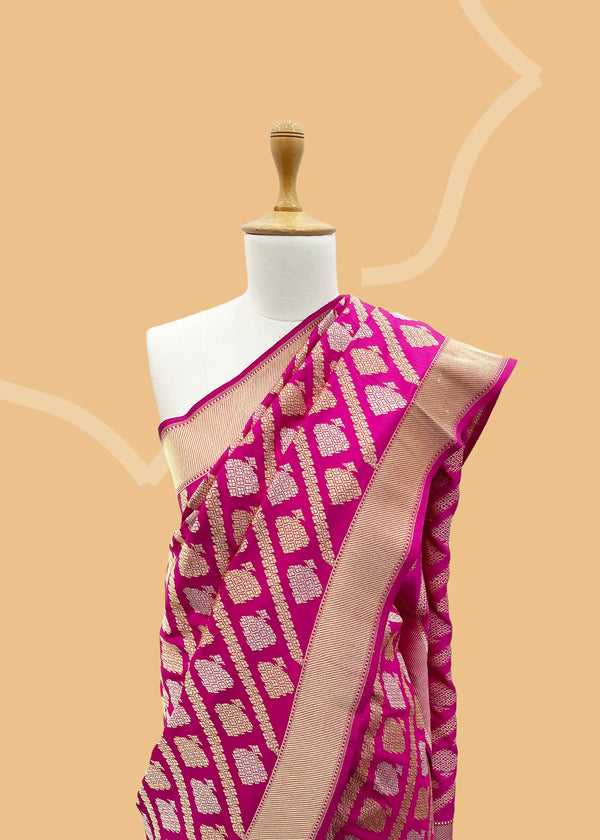 Rani pink ektaara silk pure banarasi saree. Shop the best collection of authentic, handwoven, pure benarasi sarees with Roliana New Delhi