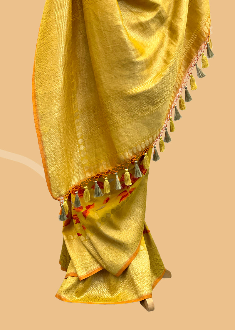 Gold tussar georgette pure banarasi saree with handwoven ivy leaves in shade of sunset and gold zari border by Roliana Delhi