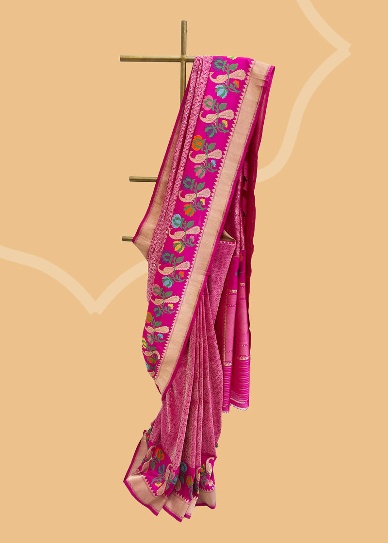 Pink Kanjeevaram style benaresi brocade saree with a beautiful meenakari border of peacocks and multi coloured flowers. Shop the best collection of authentic, handwoven, pure benarasi sarees with Roliana New Delhi