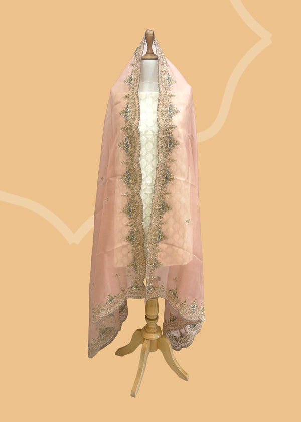  A dreamy powered pink organza dupatta with zardozi embroidery bootis and a border with ash gray contrast motifs. Shop the best of Banarasi sarees, dupattas and lehengas at Roliana New Delhi