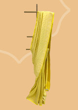 A lime yellow brocade woven saree in a very delicate design with beautiful contrast blue purple detalling.. A pure Banarasi wedding Sari Shop the best collection of authentic, handwoven, pure benarasi sarees with Roliana New Delhi