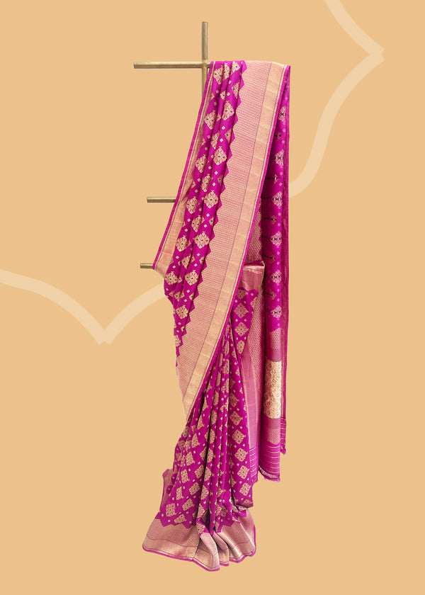 Ektaara tanchoi woven saree in rich pink with geometric bootis and a beautiful zari woven border and pallu. Shop the best collection of authentic, handwoven, pure benarasi sarees with Roliana New Delhi