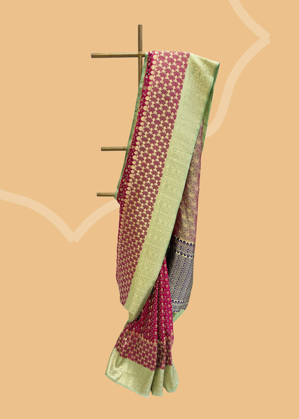 A pink tanchoi weave saree with a contrast pista green border and pallu.  Shop the best collection of authentic, handwoven, pure benarasi sarees with Roliana New Delhi